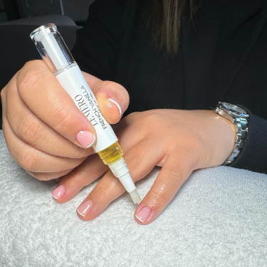 French Vanilla Cuticle oil Pen being used by Beauty Professional 